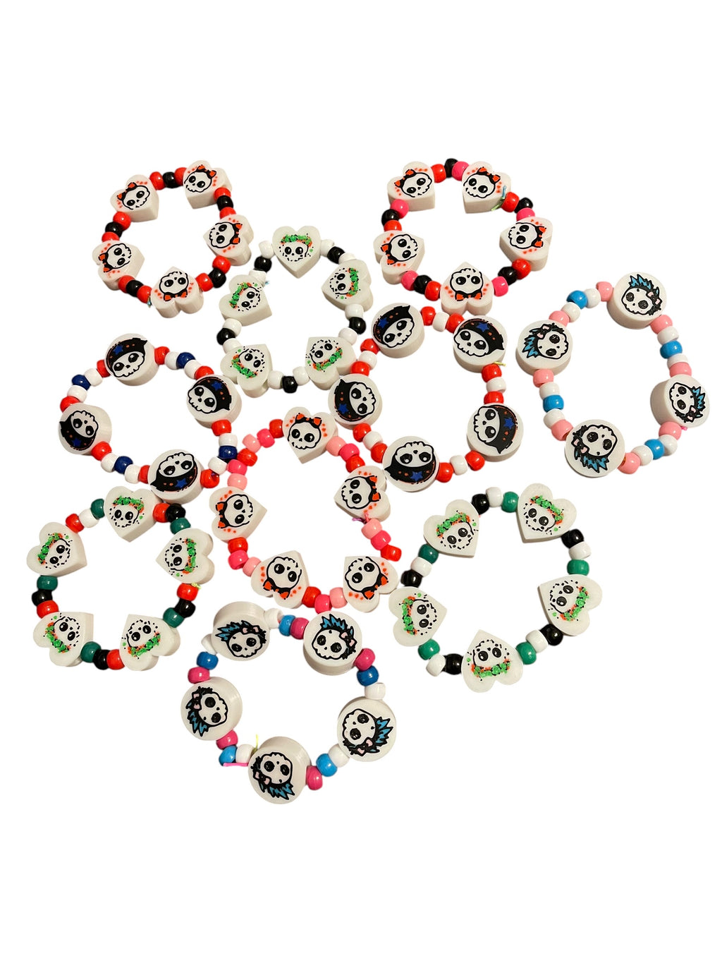 A collection of colorful 3d printed beaded bracelets with white skull-shaped charms, arranged on a plain white background.
