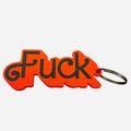 A red and black 3d printed keychain featuring the word 'Fuck' in black lettering in a Barbie font, attached to a silver metal split ring, set against a plain white background.