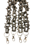 Matte black plastic keychain lanyards with interlocking studded links and gun metal color lobster clasp rings, shown on a plain white background.