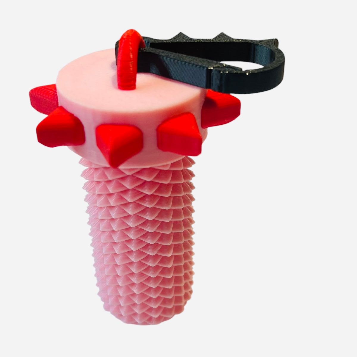 A pink textured adult stim keychain container with red spikes around the top and a black carabiner, shown on a plain white background.